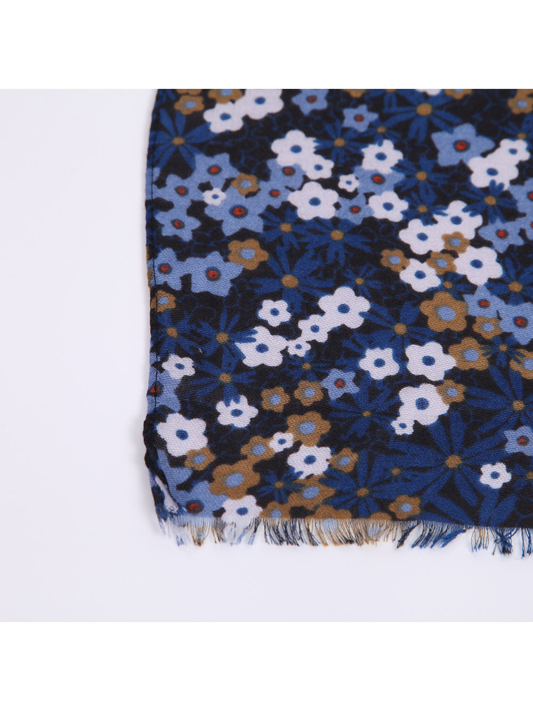 Close-up of the navy floral print and short fringed scarf edge