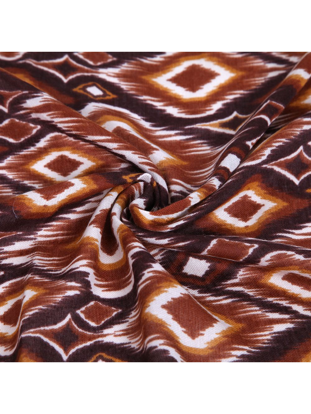 Close-up of the brown geometric diamond and four-point motif pattern