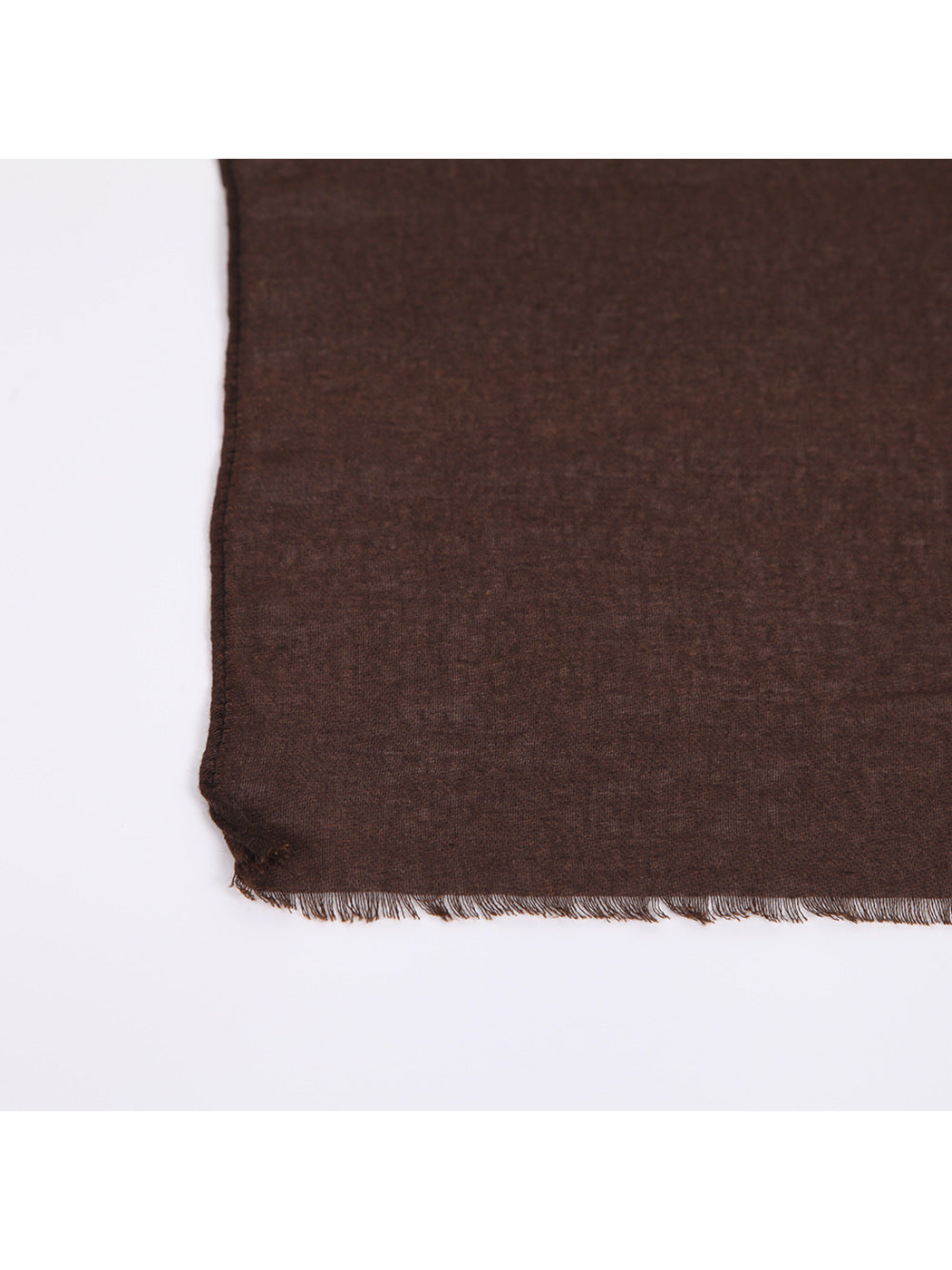 Close-up of the scarf's short fringe and stitched edge