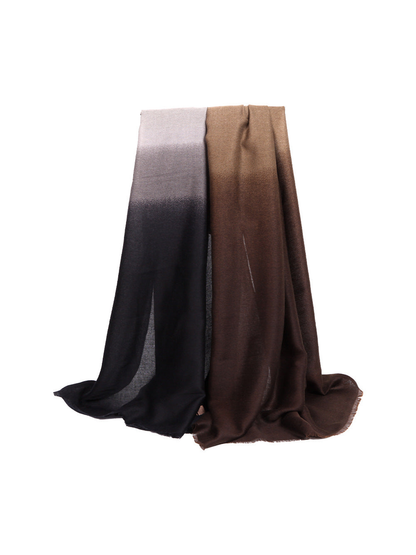 Brown and charcoal ombre scarf draped against a white background