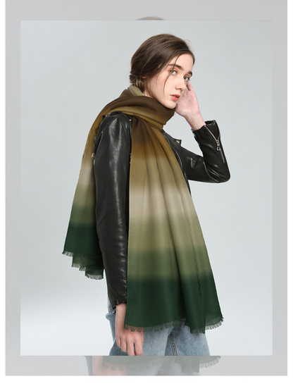 Brown, beige and green ombre scarf wrapped around the neck