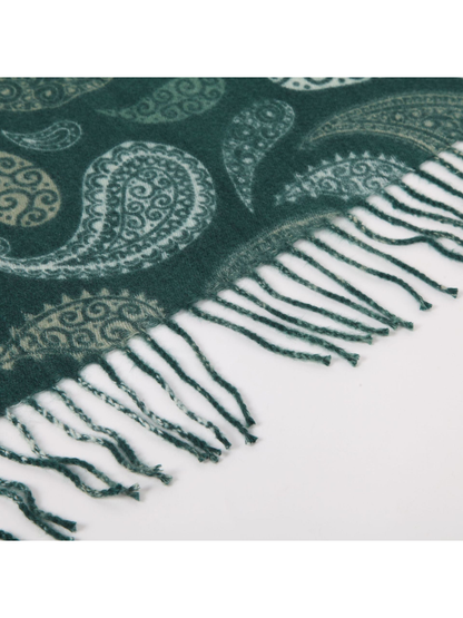 Close-up of deep teal paisley scarf texture and twisted fringe