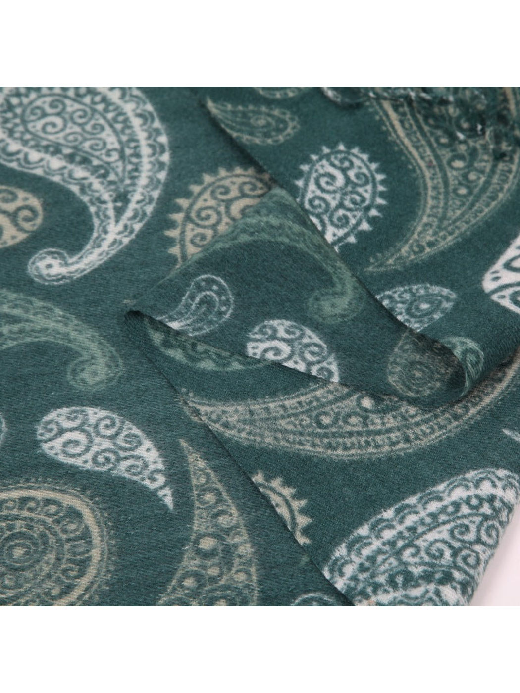 Close-up of the varied paisley motifs on the deep teal scarf