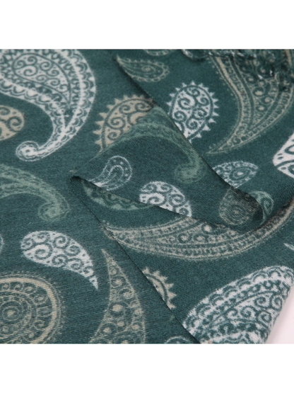 Close-up of the varied paisley motifs on the deep teal scarf