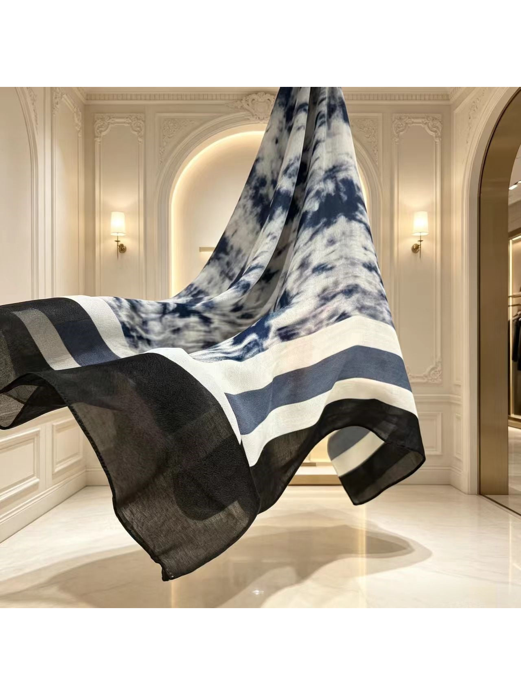 Close styling view of the flowing scarf and semi-sheer black border