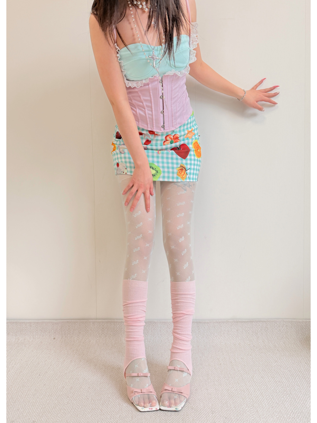 Pink ribbed knee-high open-toe socks with heel openings, full front view