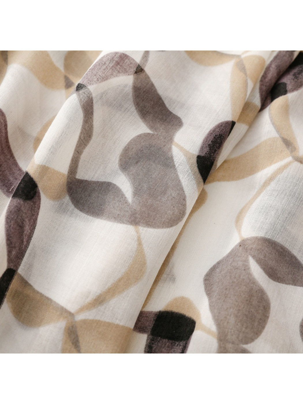 Close-up of the gray, taupe and beige interlocking abstract print