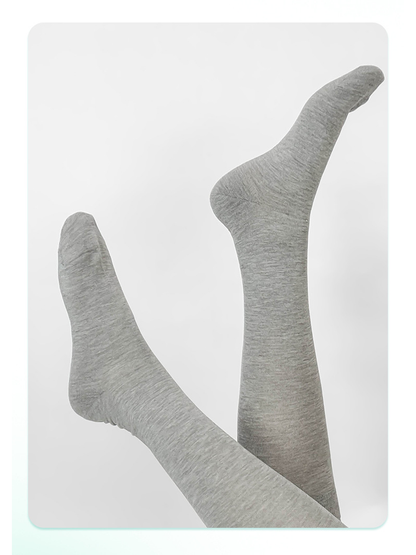 Gray knee-high socks displayed with crossed legs
