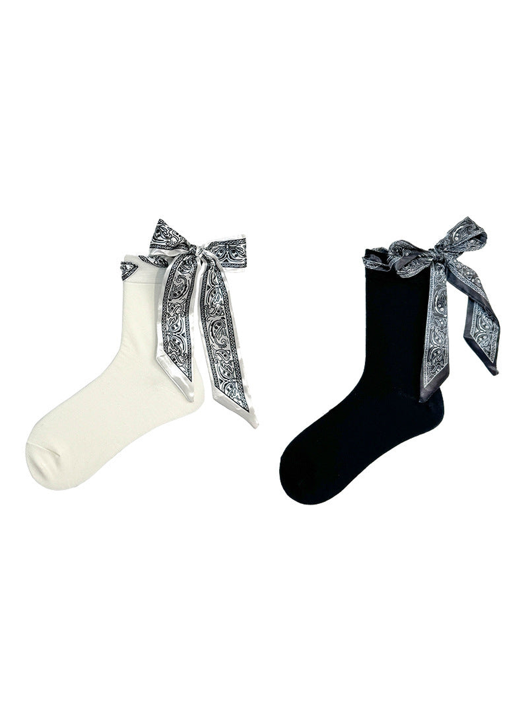 Black and ivory crew socks with paisley ribbon bows displayed together
