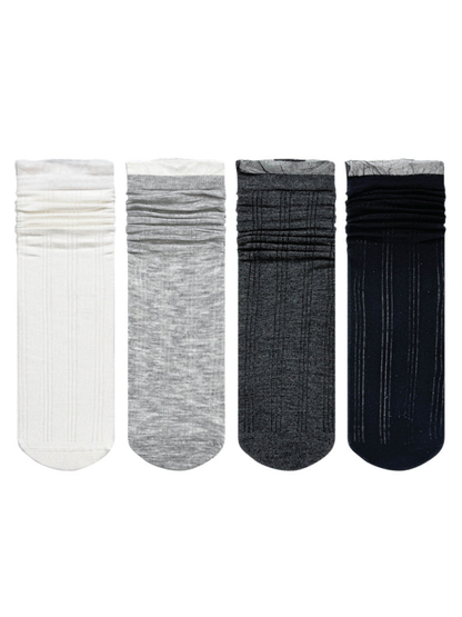 Black, white, dark gray and light gray sheer striped crew socks displayed together