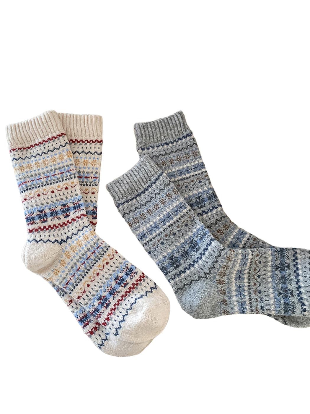 Cream, gray and black patterned crew socks displayed together