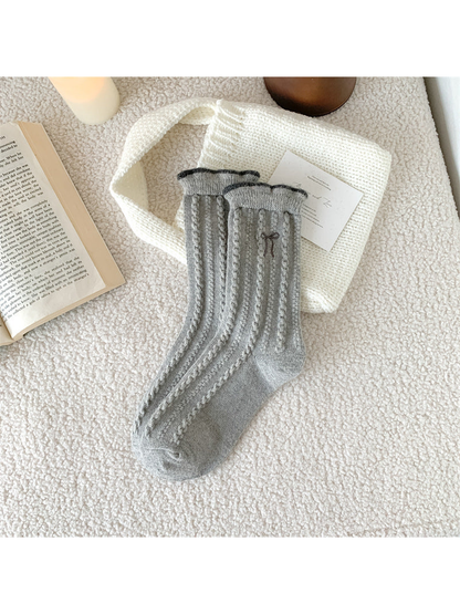 Light gray cable-knit crew socks with bow embroidery