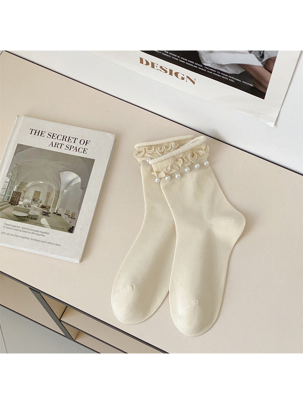 Ivory ruffled crew socks with white bead-like cuff accents