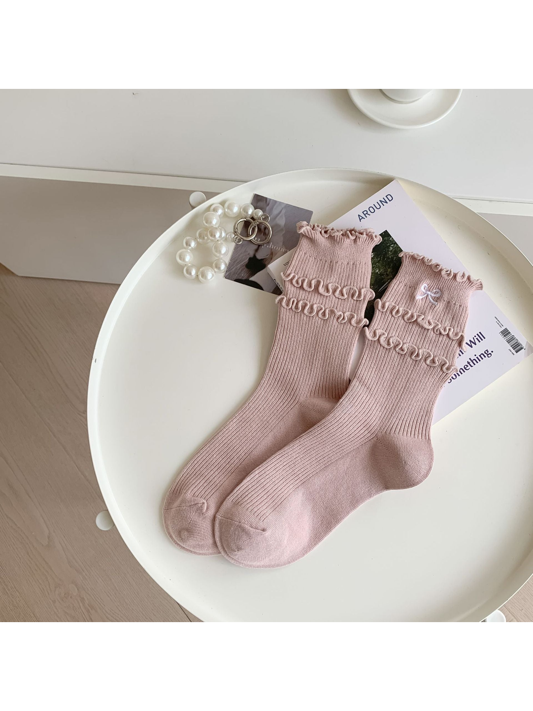 Dusty pink ruffled crew socks with embroidered bow
