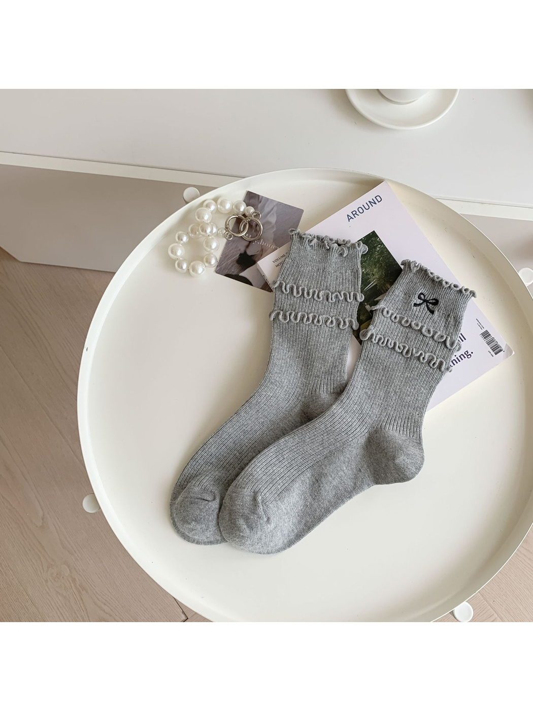 Heather gray ruffled crew socks with black embroidered bow