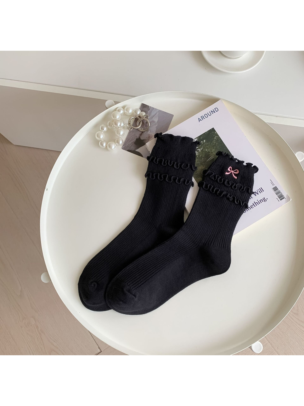 Black ruffled crew socks with pink embroidered bow