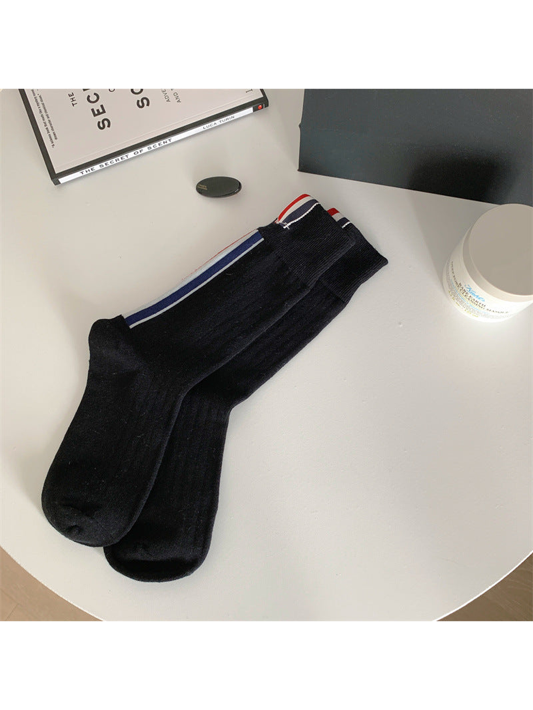 Black crew socks with side stripes and striped cuff tabs