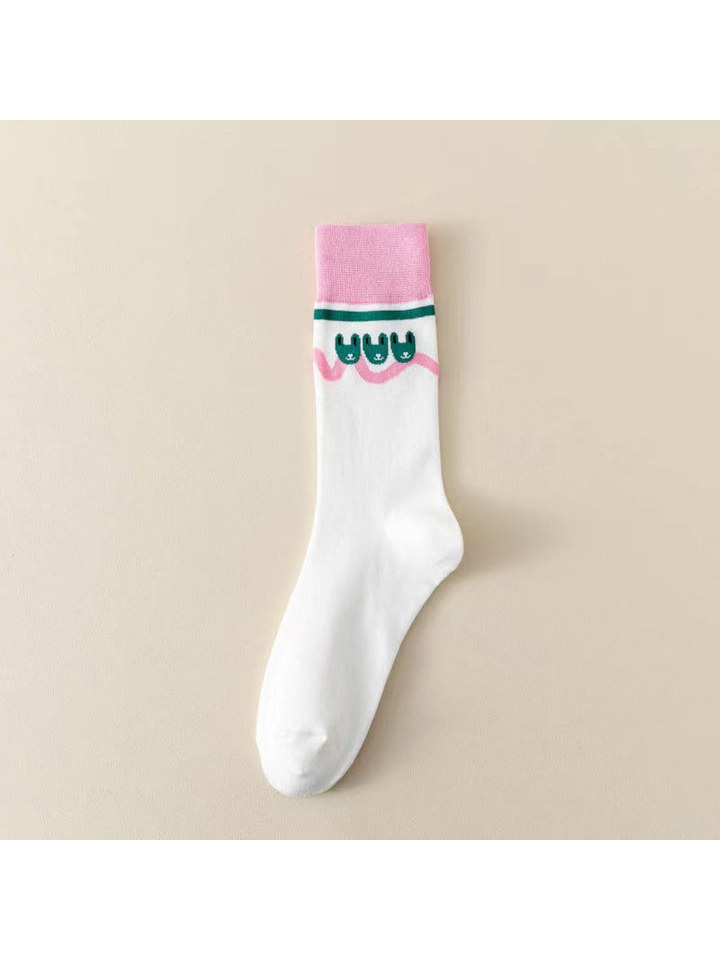 White crew sock with pink cuff and small green rabbit motifs