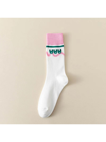 White crew sock with pink cuff and small green rabbit motifs