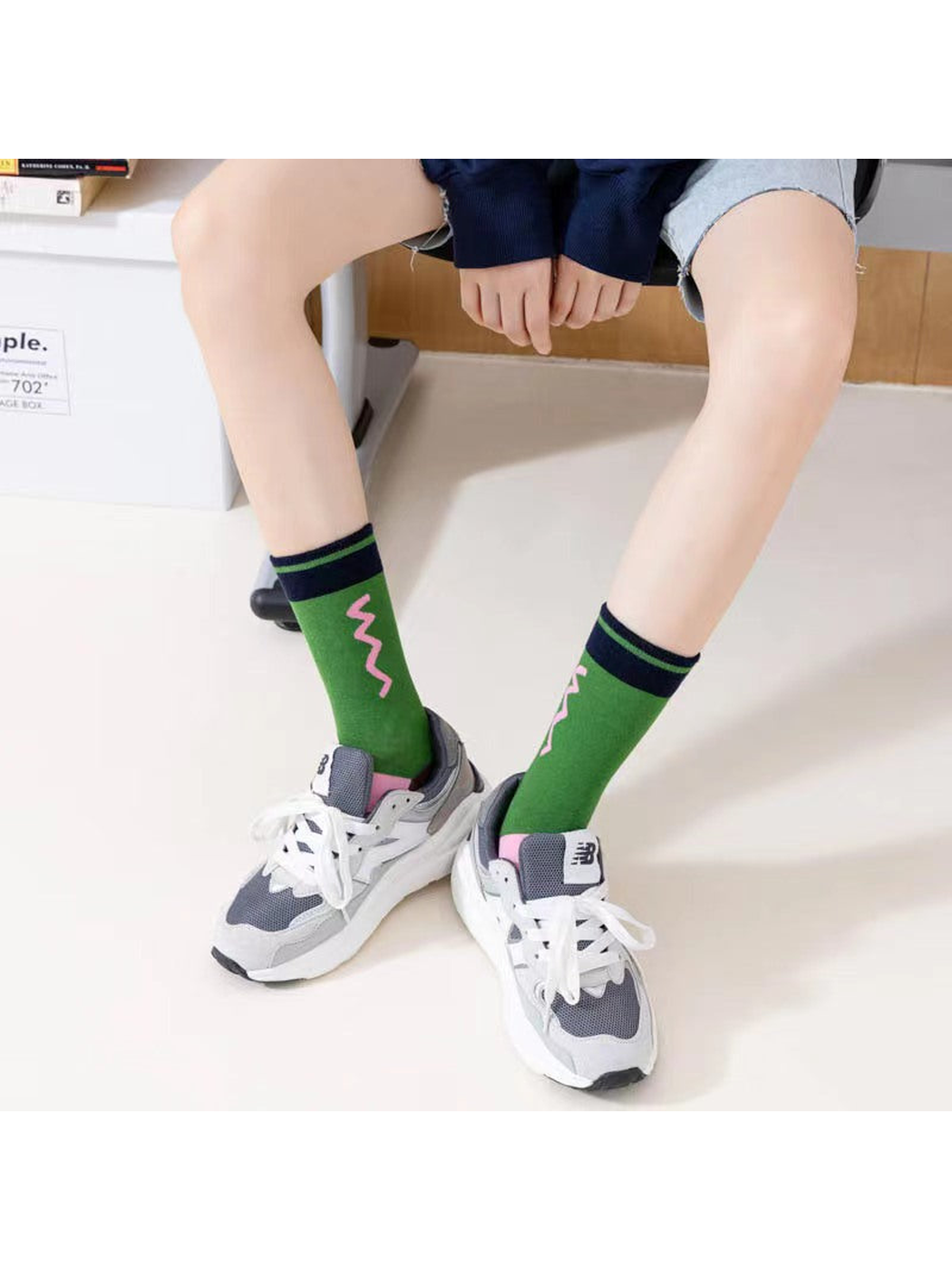 Green color-block crew socks worn with gray sneakers
