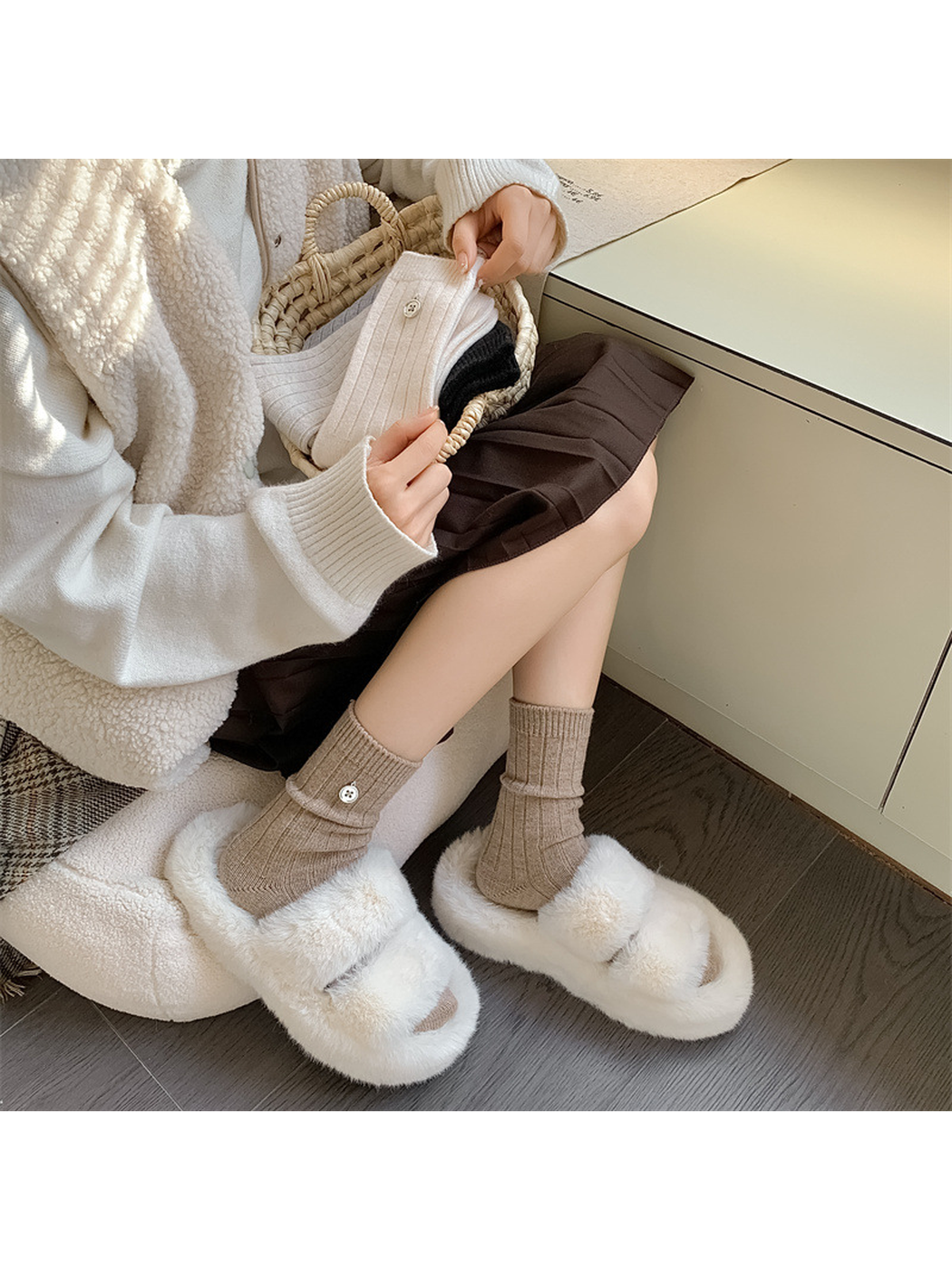 Beige ribbed crew socks worn with plush sandals