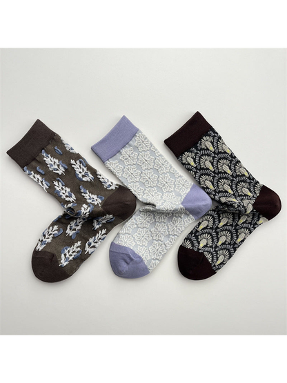 Three patterned crew sock designs displayed together