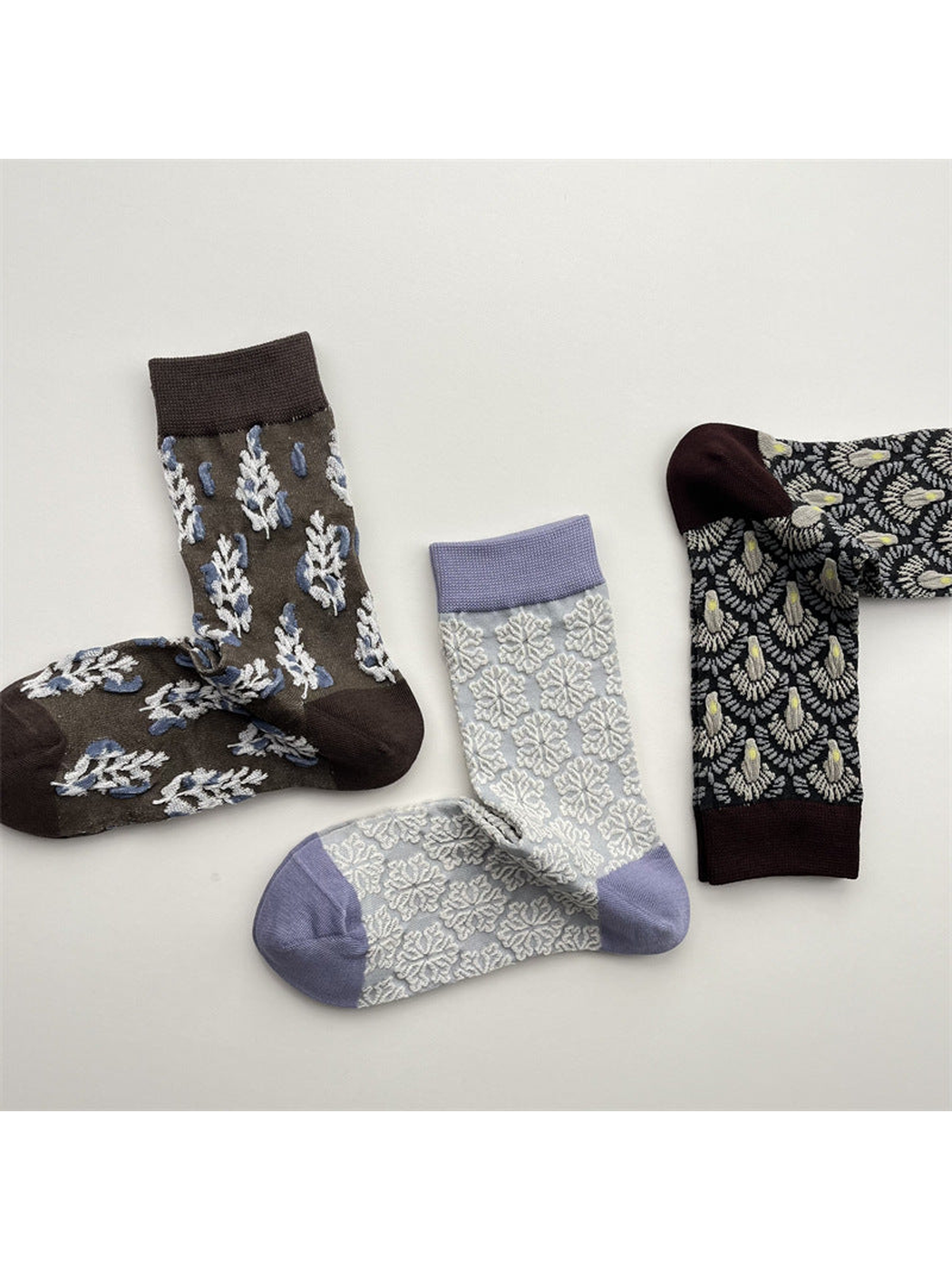 Three patterned crew sock designs arranged in an alternate group view