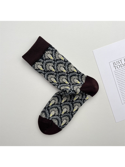 Black crew socks with raised fan motifs and dark brown trim