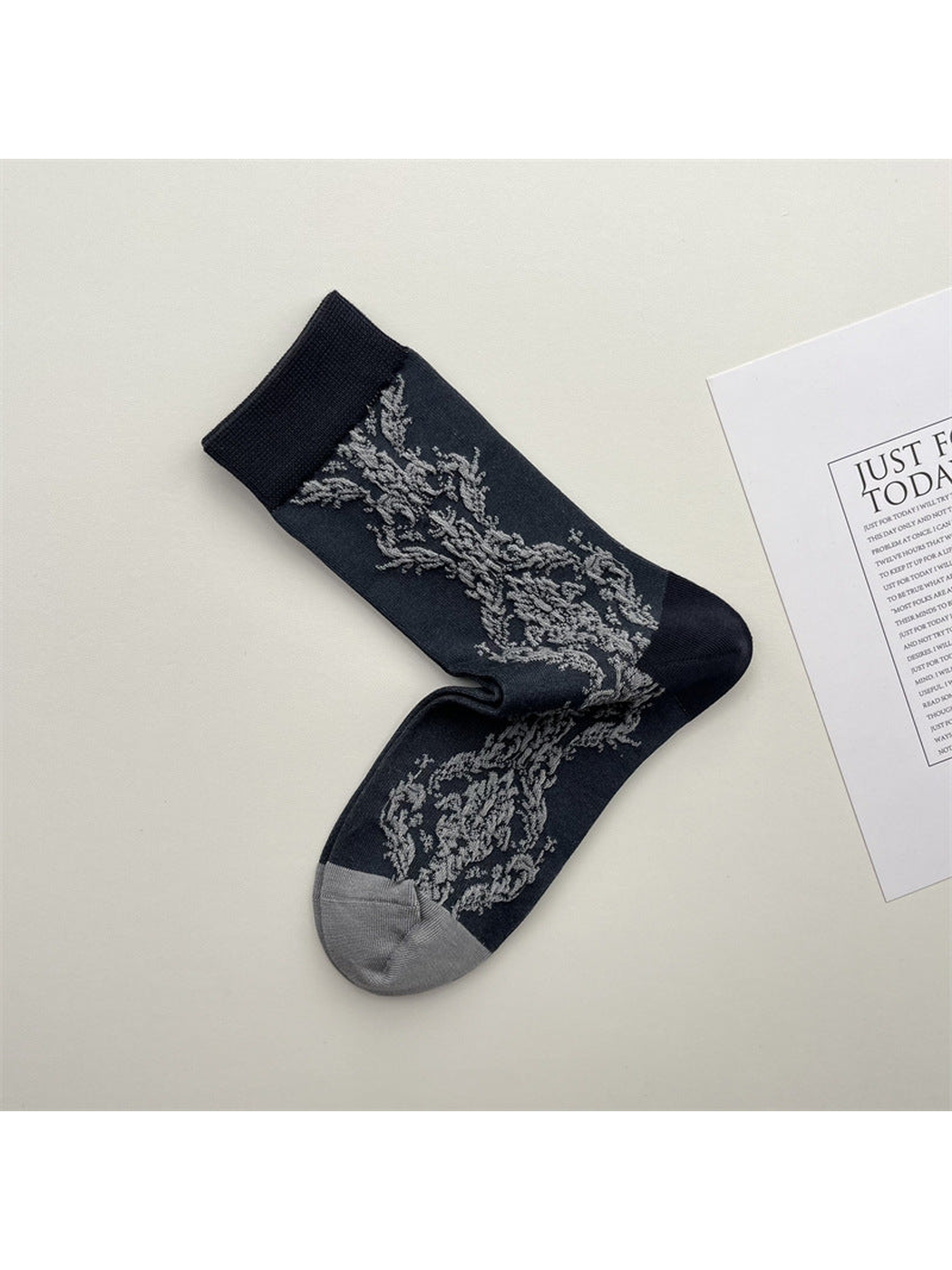Dark gray botanical-pattern crew socks with contrasting toe and cuff