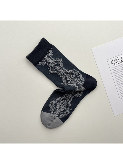 Dark gray botanical-pattern crew socks with contrasting toe and cuff