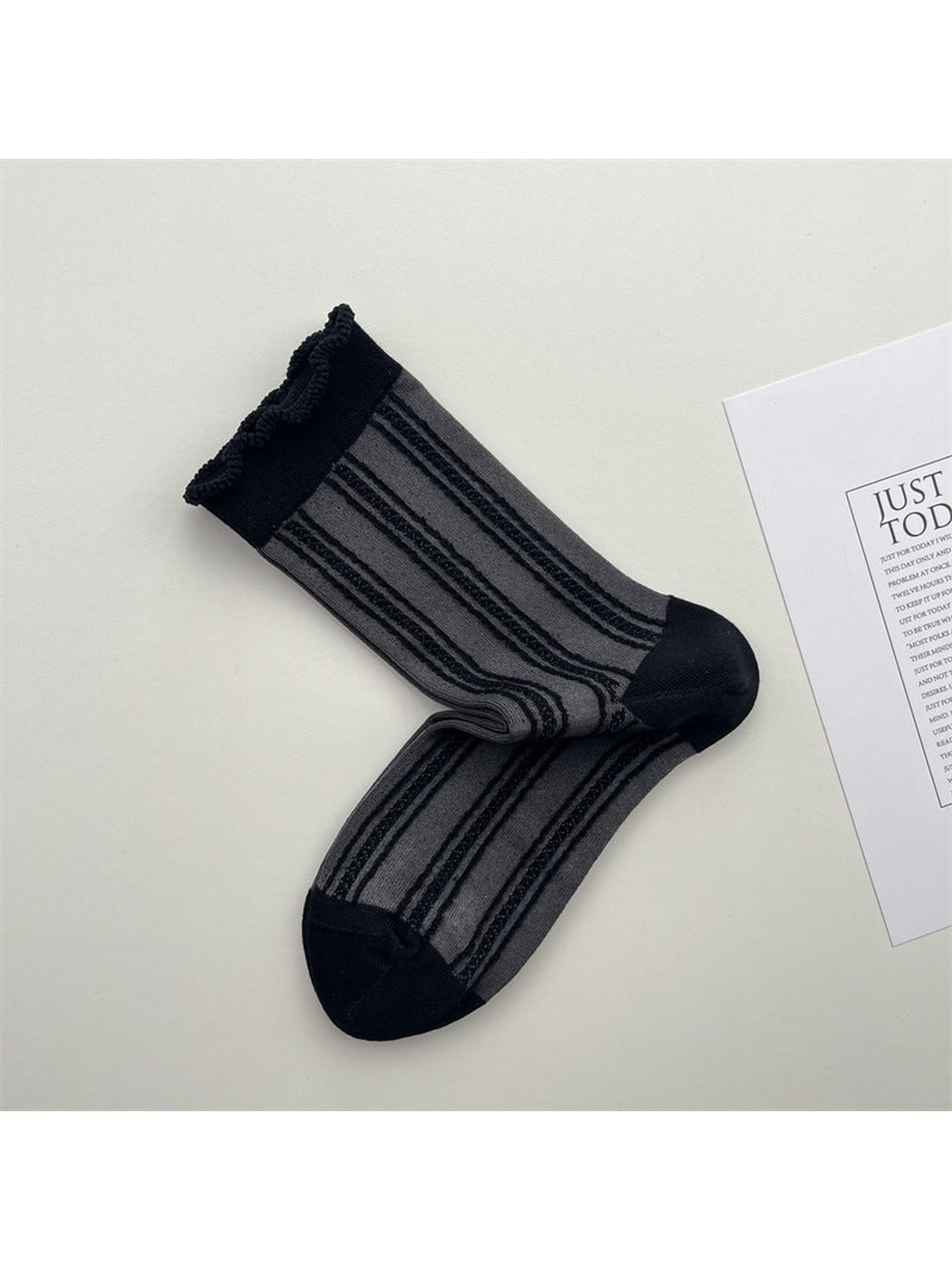 Gray sheer striped crew socks with dark toe and ruffled cuff