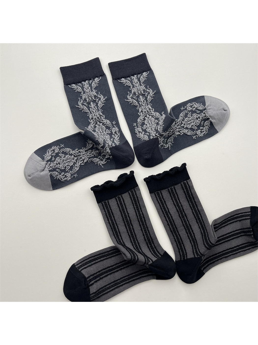 Botanical and striped crew socks arranged in pairs