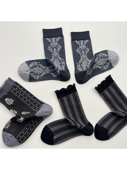 Three dark gray crew sock patterns displayed in paired arrangements