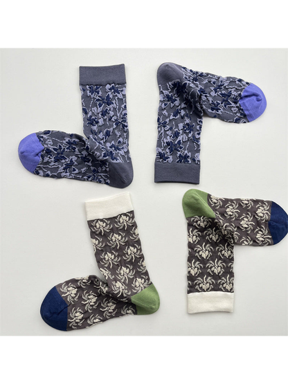 Blue floral and cream floral crew sock styles arranged in pairs