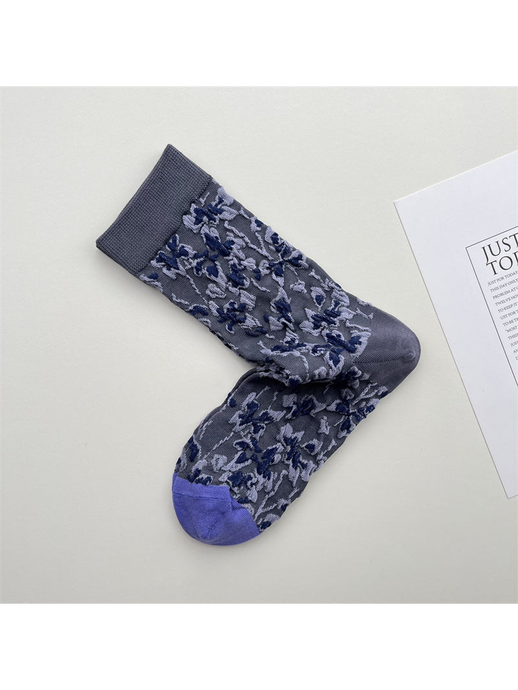 Blue-gray floral crew socks with a gray cuff and purple toe