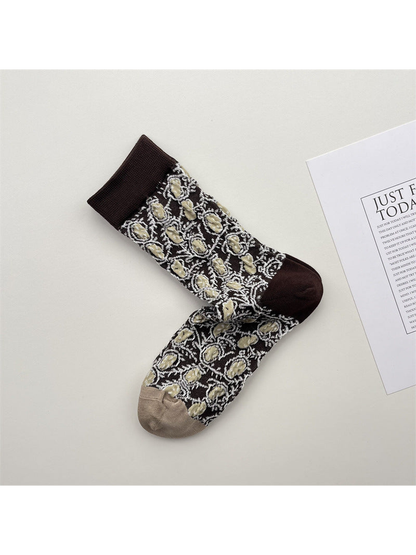 Dark brown crew socks with cream and beige medallion pattern