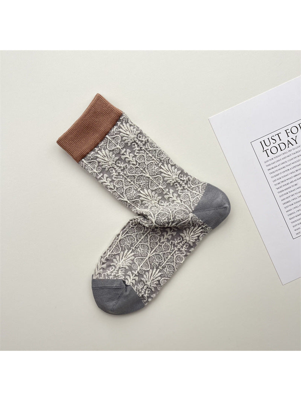 Light gray crew socks with ivory ornamental floral pattern