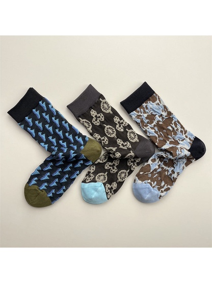 Three patterned crew sock designs displayed together