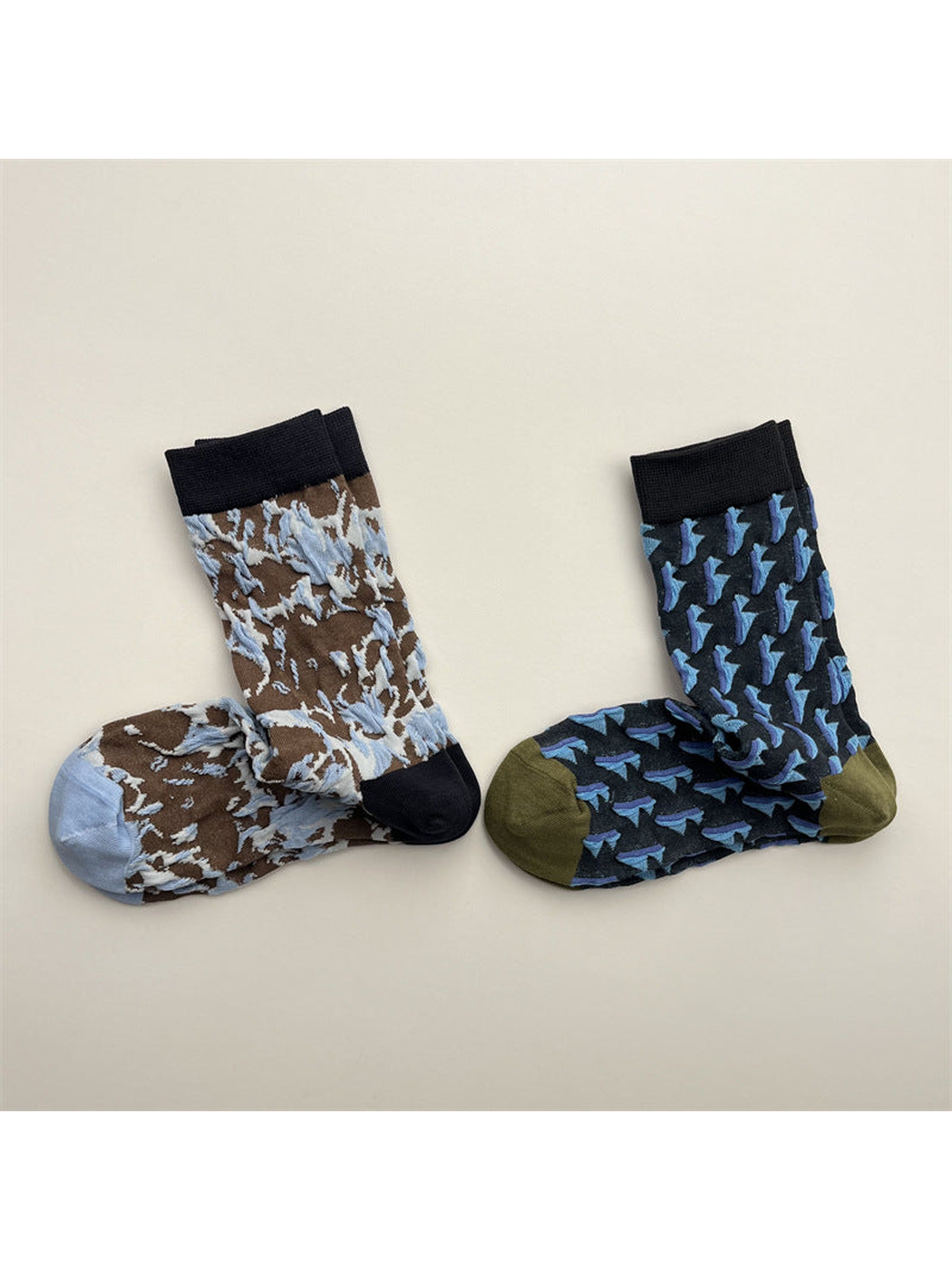 Brown marbled and navy triangle crew socks displayed side by side
