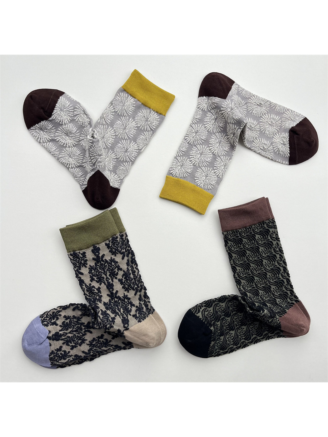 Three sheer patterned crew sock designs with contrasting cuffs and toes