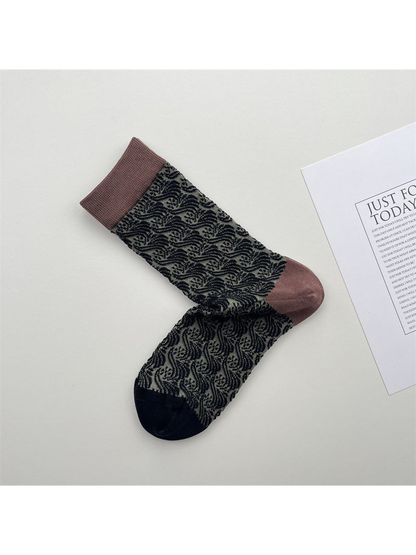 Black and gray sheer crew socks with leaf pattern and muted brown cuffs
