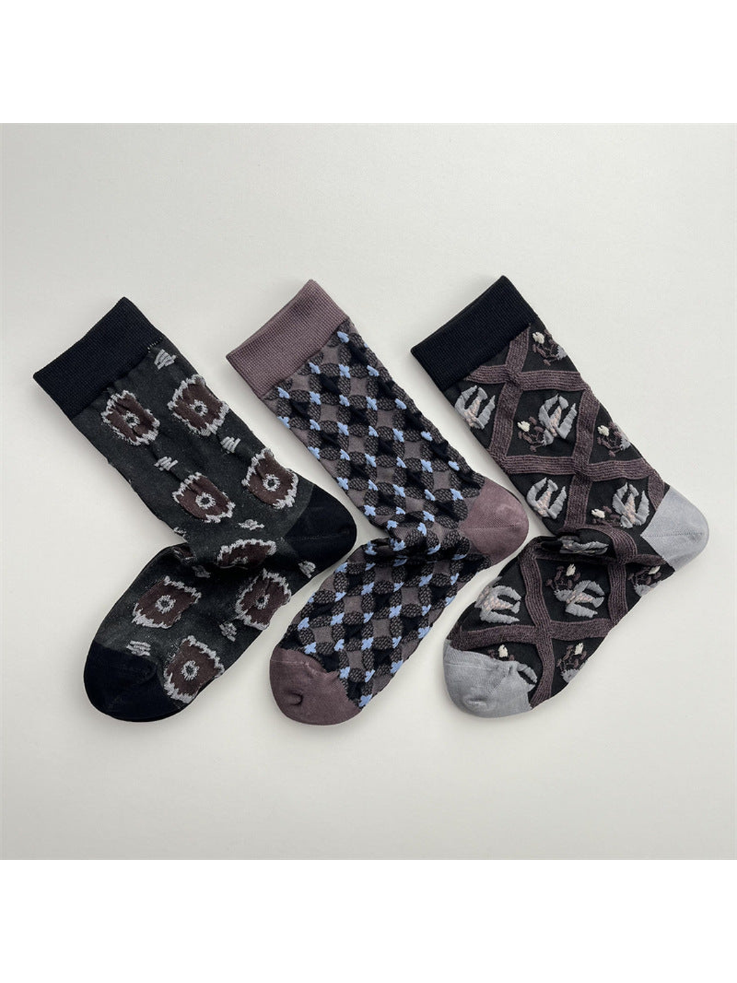 Three patterned crew sock designs displayed together
