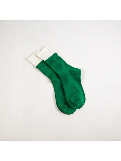 Green crew socks with contrasting white ribbed cuffs
