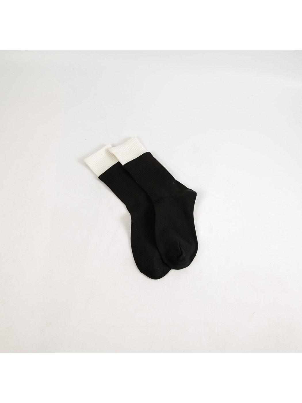 Black crew socks with contrasting white ribbed cuffs