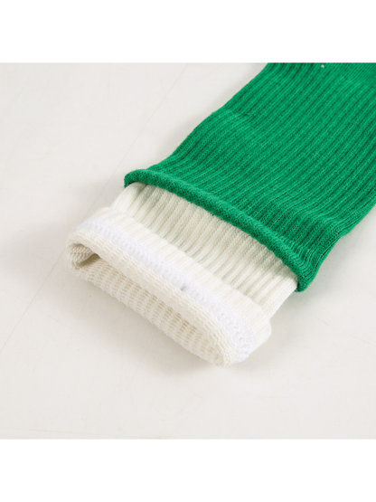 Close-up of the green ribbed leg and layered white cuff