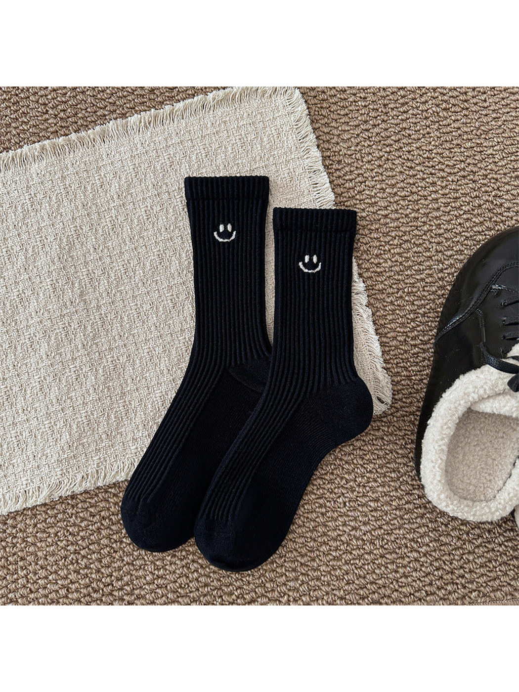 Black ribbed smiley crew socks, full product view