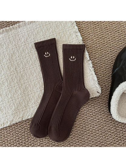 Dark brown ribbed smiley crew socks, full product view
