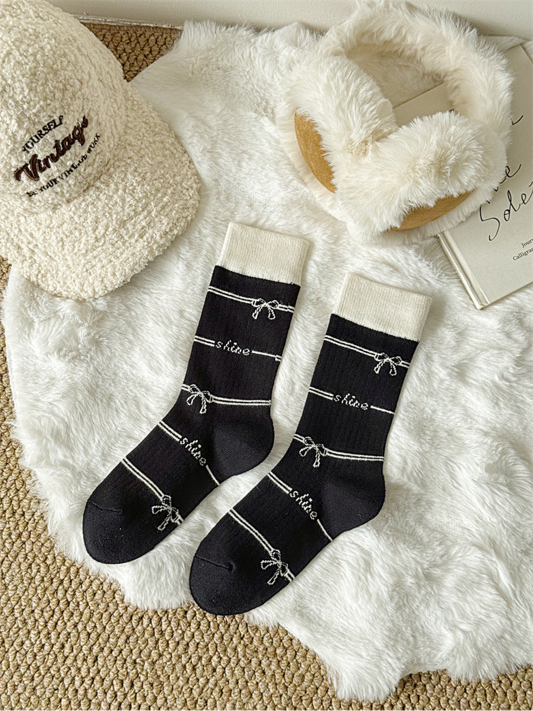 Black bow-and-stripe crew socks with contrasting ivory cuffs