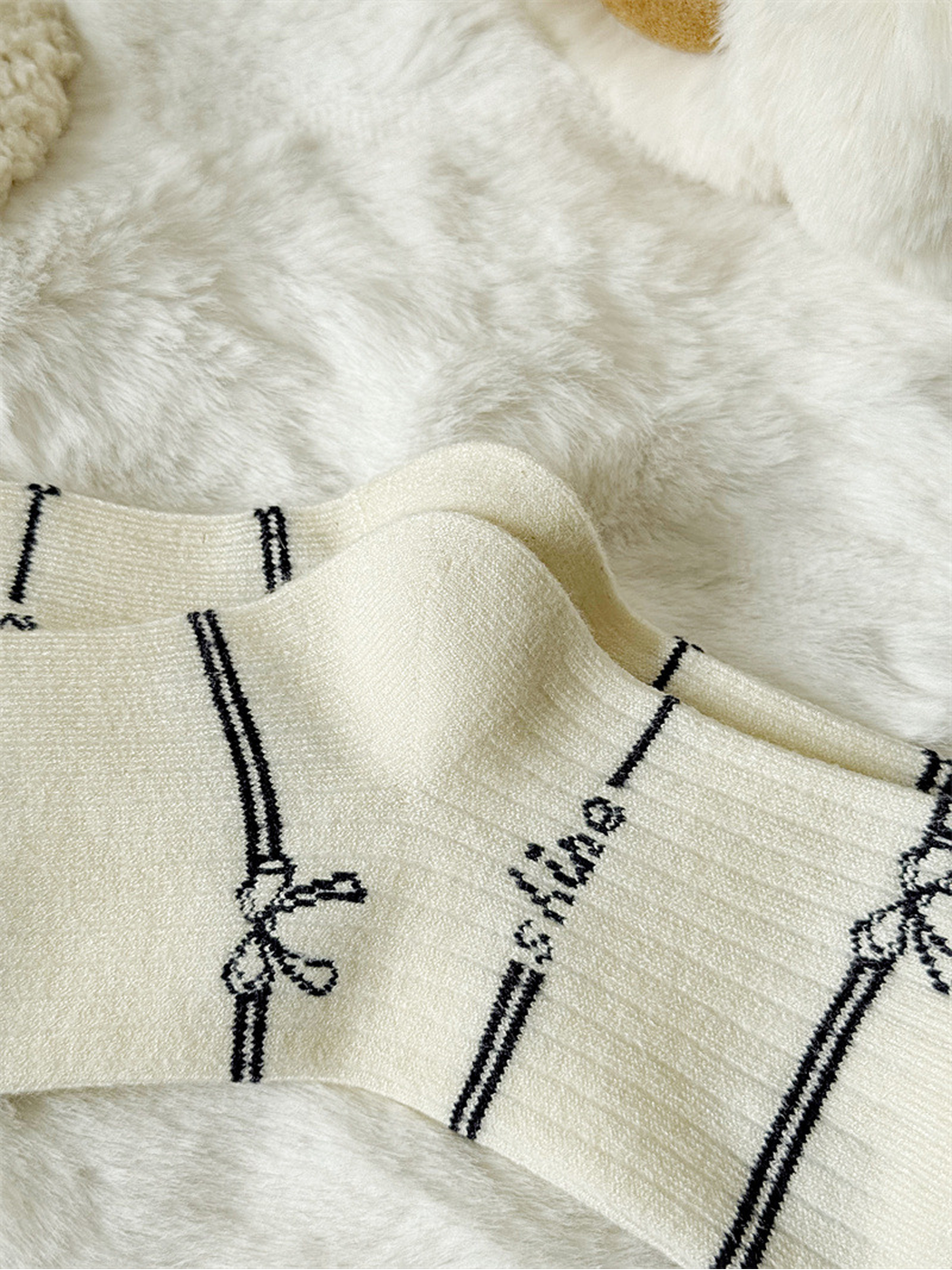 Close-up of the ivory sock ribbing and shaped heel