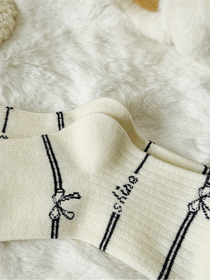 Close-up of the ivory sock ribbing and shaped heel